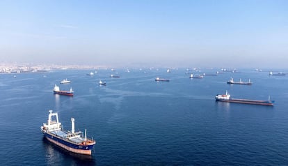 Commercial vessels including vessels which are part of Black Sea grain deal wait to pass the Bosphorus strait off the shores of Yenikapi during a misty morning in Istanbul, Turkey, in 2022.