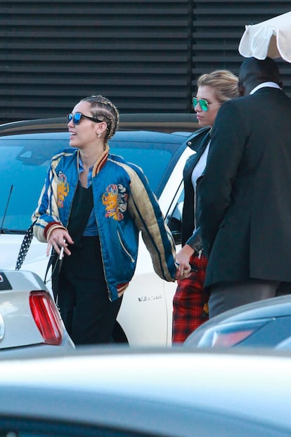 Miley Cyrus and Stella Maxwell strolling through the streets of Malibu, California, in 2015.