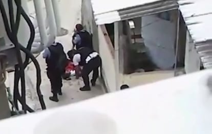 A still from the video of police purportedly altering the murder scene in Rio.