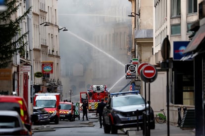 French firefighters work after several buildings on fire following a gas explosion in the fifth arrondissement of Paris, France, on June 21, 2023.