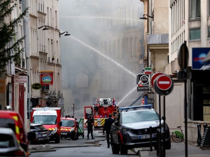 French firefighters work after several buildings on fire following a gas explosion in the fifth arrondissement of Paris, France, on June 21, 2023.