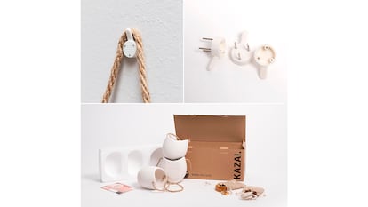 Macetas colgantes de pared sobre fondo blanco.