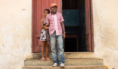 Jospeh Duo, a former child soldier in Liberia, with his daughter.