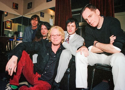 Jody Stephens, Jon Auer (The Posies), Mike Mills (R.E.M.), Ken Stringfellow (The Posies) and Alex Chilton posing at The Fillmore in San Francisco, California, on March 2, 2002. 