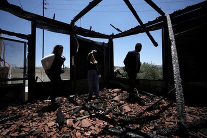 An international delegation examines a torched building as they tour the West Bank town of Turmus Ayya, days after a rampage by Jewish settlers, on June 23, 2023.
