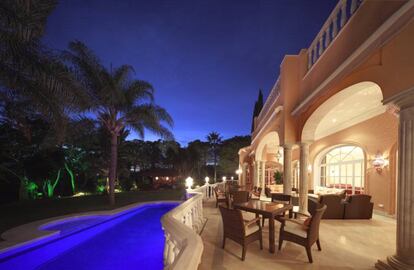 The terrace and pool by night.