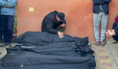 A mourner reacts next to the bodies of Palestinians killed in Israeli strikes, amid the ongoing conflict between Israel and Palestinian Islamist group Hamas, at Nasser hospital in Khan Younis, in the southern Gaza Strip, December 23, 2023.