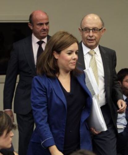 Santamaría, Montoro y Guindos, tras el Consejo.