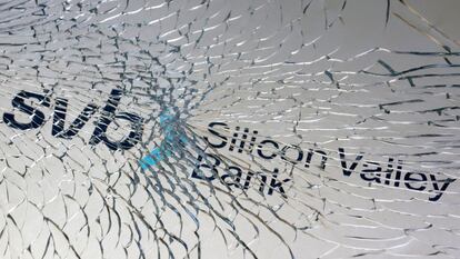 The Silicon Valley Bank logo seen through broken glass.