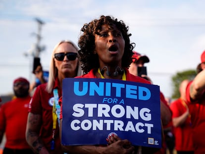 A Ford employee holds a sign during a UAW rally to support striking workers outside an assembly plant in Louisville, Kentucky, on September 21, 2023.