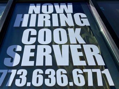 A hiring sign is displayed at a restaurant in Mount Prospect, Illinois, on March 19, 2023.