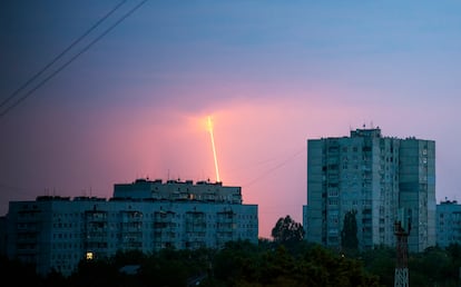 A Russian rocket launched toward Ukraine from Russia's Belgorod region is seen at dawn in Kharkiv, Ukraine, Thursday, Aug. 11, 2022. (AP Photo/Vadim Belikov)