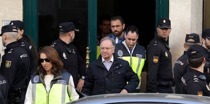 The head of Manos Limpias, Miguel Bernad, is taken away by police.