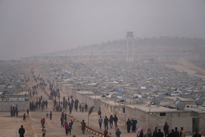 Syrians walk along in a refugee camp for displaced people run by the Turkish Red Crescent in Sarmada district, north of Idlib city, Syria, on Nov. 26, 2021.
