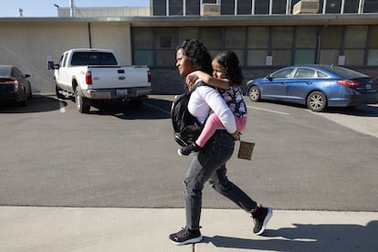 Deysi Vargas carries her daughter S.G.V. on most of the 15-minute walk to the school since the youngster can't walk for very long. S.G.V. has short bowel syndrome and is fed intravenously. Her family's humanitarian parole was revoked by the Trump administration. Doctors say the child could die within days without treatment