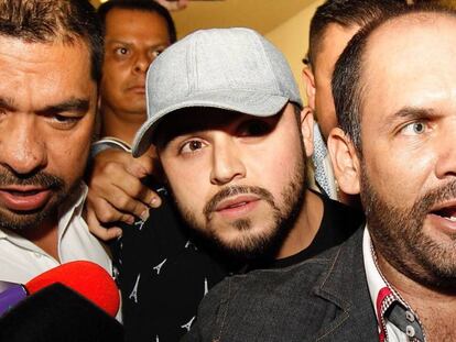 Singer Gerardo Ortiz (c) after making a statement.