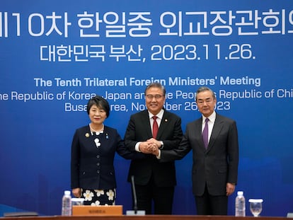 Chinese Foreign Minister Wang Yi, right, South Korean Foreign Minister Park Jin, center, and Japanese Foreign Minister Yoko Kamikawa pose for a photo prior to the trilateral foreign ministers' meeting in Busan, South Korea, Sunday, Nov. 26, 2023.