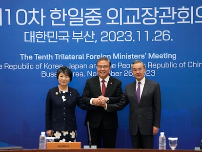 Chinese Foreign Minister Wang Yi, right, South Korean Foreign Minister Park Jin, center, and Japanese Foreign Minister Yoko Kamikawa pose for a photo prior to the trilateral foreign ministers' meeting in Busan, South Korea, Sunday, Nov. 26, 2023.