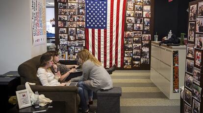 Three staff members work at the campaign headquarters.