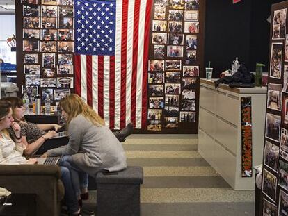 Three staff members work at the campaign headquarters.