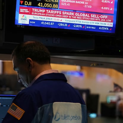 Traders work on the floor at the New York Stock Exchange in New York, Thursday, April 3, 2025. (AP Photo/Seth Wenig)