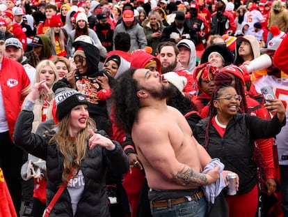 Fans dance to the music during the Kansas City Chiefs' victory celebration and parade in Kansas City, Mo., Wednesday, Feb. 15, 2023.