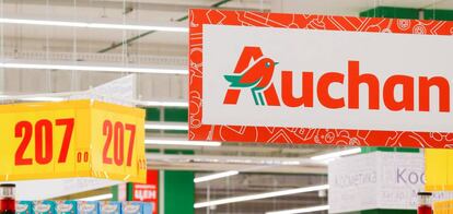 FILE PHOTO: The logo of French retailer Auchan is pictured at company&#039;s hypermarket in Moscow