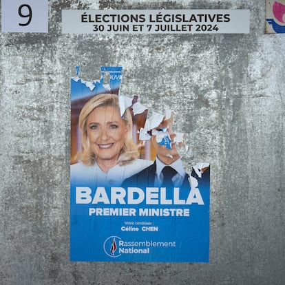 PARIS, FRANCE - JUNE 23: An electoral poster featuring Marine le Pen and the defaced photo of Jordan Bardella, of the far right party the Rassemblement National, or National Rally, in the 10th arrondissement on June 23, 2024 in Paris, France. Posters with images of the candidates for the legislative elections are being put up in front of various voting stations, such as public schools and other municipality buildings. The first round of voting will take place on June 30th 2024, followed a week later by the second round of voting on July 7th 2024. These elections are the result of the decision of the French president, Emmanuel Macron, to dissolve parliament after gains by the far-right party Rassemblement National, or National Rally during the recent European elections. (Photo by Remon Haazen/Getty Images)