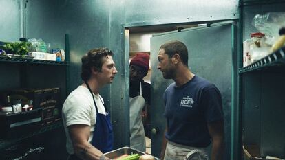 Jeremy Allen White in the kitchen sporting his habitual white T-shirt. 