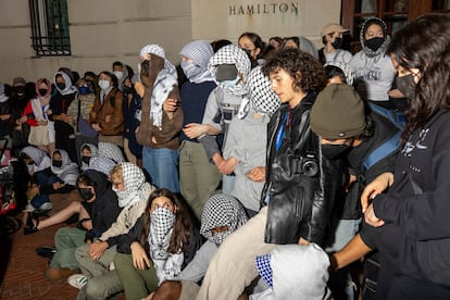 Students lock arms to guard fellow protestors who barricaded themselves inside Hamilton Hall, where the office of the Dean is located, and named it after a Palestinian child allegedly killed by the Israeli military on Tuesday, April 30, 2024 in New York City. 