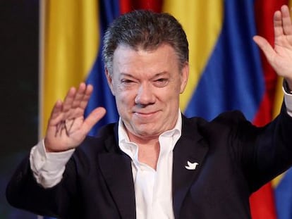 Juan Manuel Santos greets supporters after his victory on Sunday.