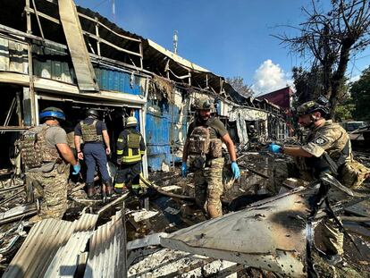 Police officers and rescuers inspect the site of a Russian military strike in Kostiantynivka, Donetsk region, Ukraine, September 6, 2023.