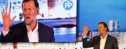 Prime Minister Mariano Rajoy addresses a rally in A Coruña with marks from the punch visible on his face.