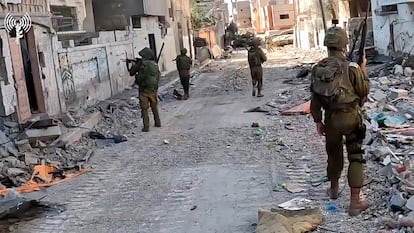 IDF armored forces patrol a village in the Gaza Strip on Thursday.