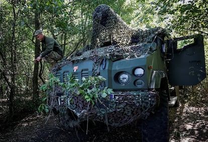 A Ukrainian serviceman squats on a 2S22 Bohdana self-propelled howitzer at a position in Donetsk region, September 13, 2023.