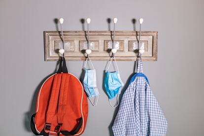 Coat rack of a school boy in a new normality