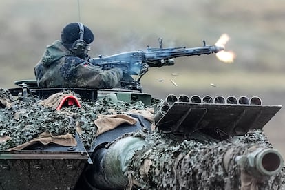 A soldier fires a machine gun from a Leopard 2 tank at the Bundeswehr tank battalion 203 at the Field Marshal Rommel Barracks in Augustdorf, Germany, on February 1, 2023.