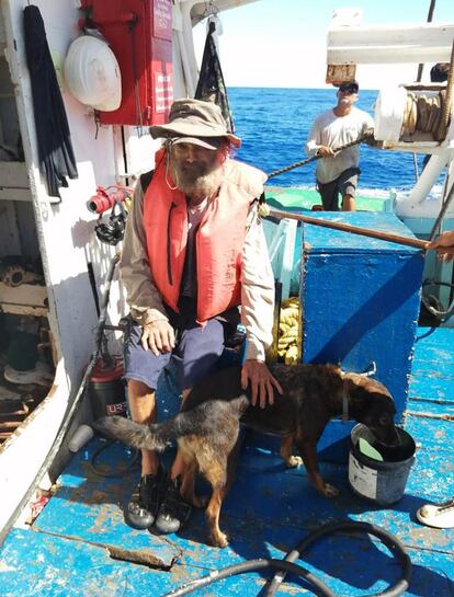 Australian Timothy Lyndsay Shaddock and his dog Bella after being rescued by a Grupomar vessel in the Pacific Ocean, Mexico