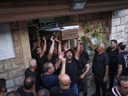 Mourners carry the coffins of two of the five Palestinian citizens of Israel, killed a day earlier when a gunman opened fire at a car wash in Yafa an-Naseriyye, Israel, during their funeral, on June 8, 2023