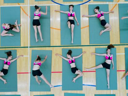 Girl in different positions on exercise mat
