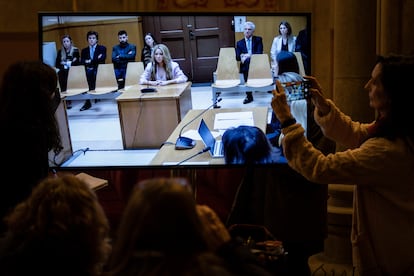 Reporters following the hearing inside the courthouse on Monday. 