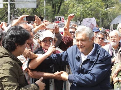 Andrés Manuel López Obrador (right) greets supporters on Sunday.