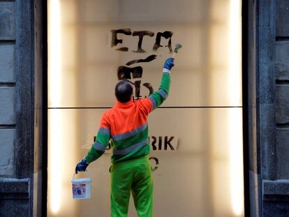 A worker cleans graffiti in support of Basque terror group ETA.