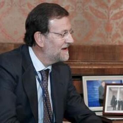 Mariano Rajoy y Angela Merkel, durante una reunion mantenida en un congreso del Partido Popular Europeo en 2009