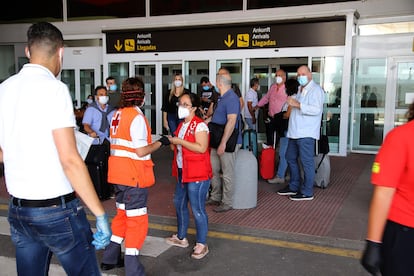 A group of passengers at Lanzarote airport on Friday.