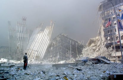 A man contemplates among the ruins of the Twin Towers after the 9/11 attacks.