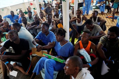 Migrants attend a Spanish class on board the ‘Open Arms.’