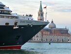 Venice (Italy), 21/09/2013.- (FILE) - The cruise ship 'Queen Victoria' passing by in front of the Campanile tower on Venice's Piazza San Marco Square, in Venice, Italy, 23 September 2013 (reissued 26 March 2021). The Italian government on 25 March 2021 announced to temporary suspend transit of cruise ships past St. Mark's square of Venice. Instead, the cruise ships will have to dock at an industrial port. (Italia, Niza, Venecia) EFE/EPA/ANDREA MEROLA *** Local Caption *** 51331667