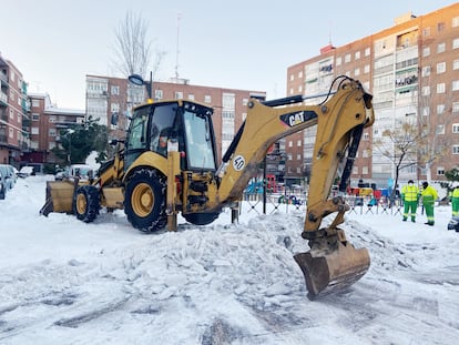 A digger removing ice from a street in Alcorcón, in the Madrid region.