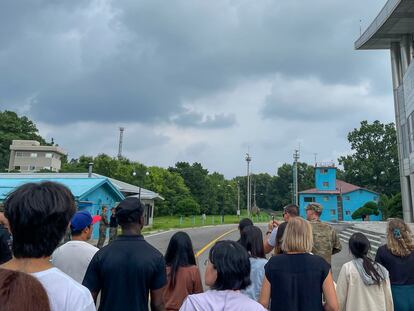 A group of tourists stand near a border station at Panmunjom in the Demilitarized Zone in Paju, South Korea, Tuesday, July 18, 2023.